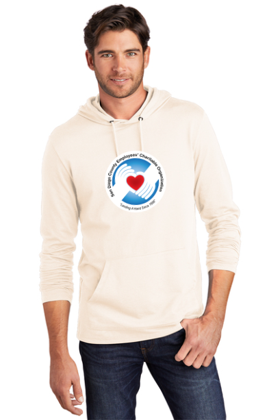 Man wearing a beige hoodie with a logo on a white background